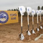 Breaking of the grounds image for the Youngsville Academy for the construction build.